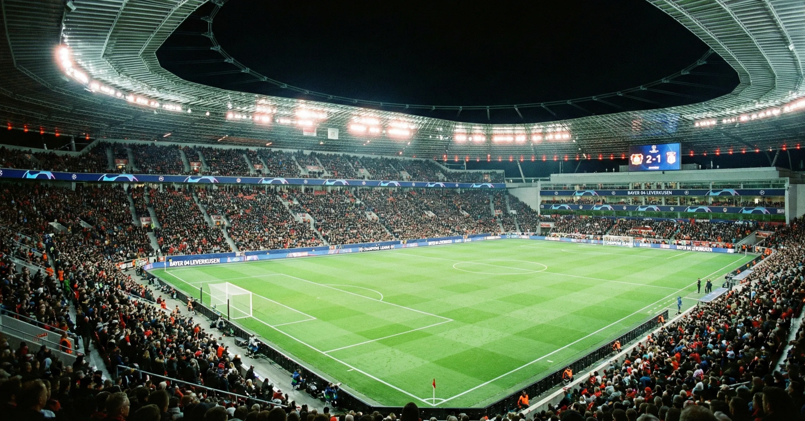 Football stadium at night with Champions League atmosphere and floodlights